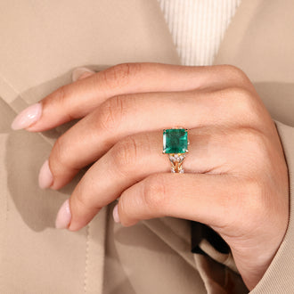 Marquise side stone emerald engagement ring.
