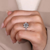 Four claw prong round diamond ring.
