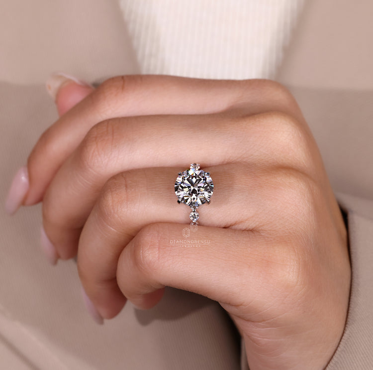 Four claw prong round diamond ring.
