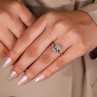 Leaf style prong setting in hidden halo engagement ring
