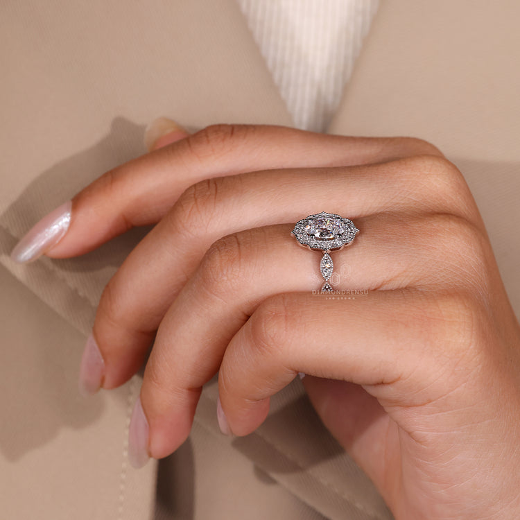 Marquise shape outline diamond ring in white gold.
