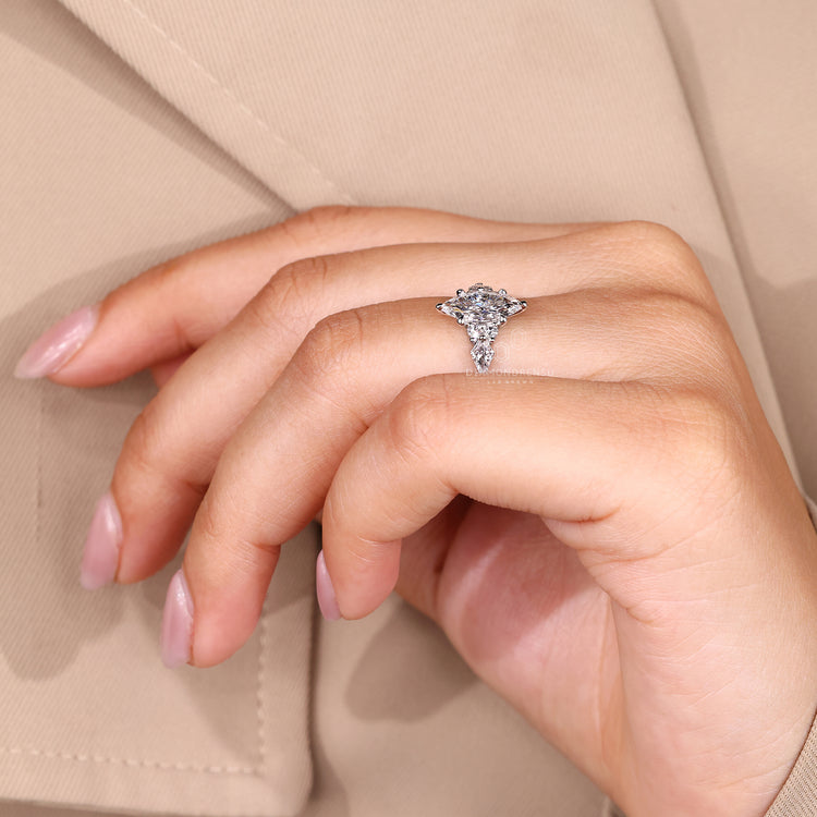 Tapered shank marquise diamond engagement ring.
