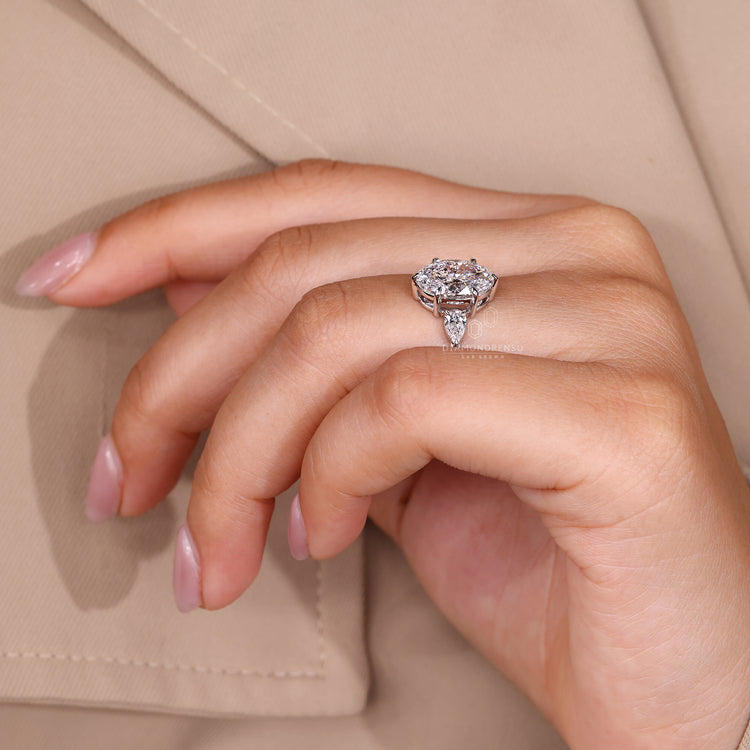 Lab Grown Diamond five stone ring with oval cut center diamond.
