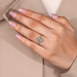 White gold ring with oval cut diamond and six claw prong.
