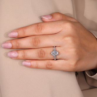 Handmade jewelry ring with oval cut diamond and tapered shank design.
