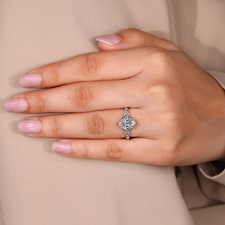 Handmade jewelry ring with oval cut diamond and tapered shank design.
