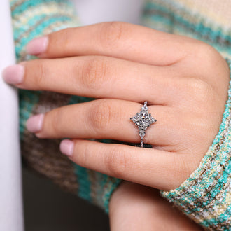 Muse setting marquise diamond engagement ring.
