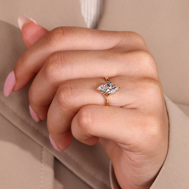 Lab grown marquise diamond bypass solitaire ring.