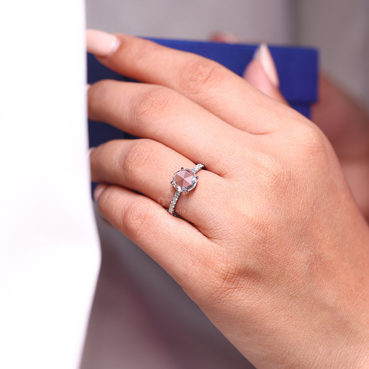 Pave setting ring with rose cut diamond and round cut pave band.
