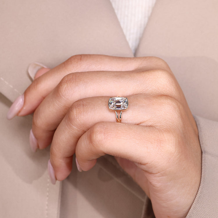 Bezel set lab grown diamond ring with elegant split shank band.
