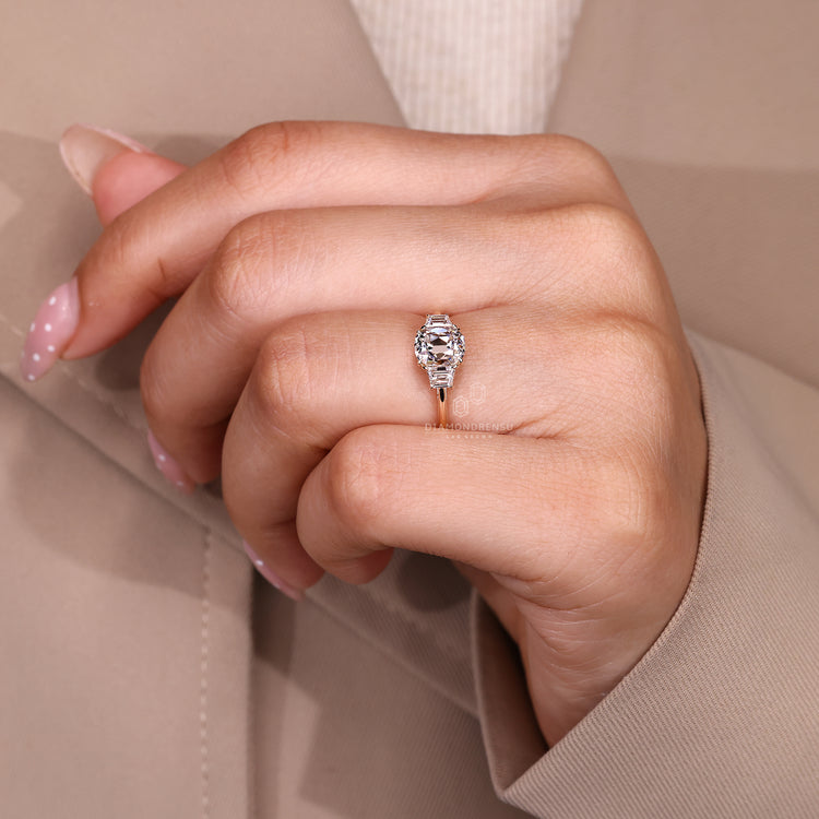 Elegant diamond ring with cushion old mine center and cathedral setting.