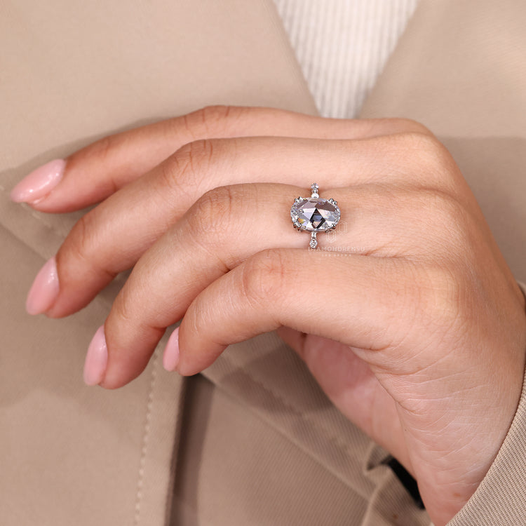 Double prong setting ring holding oval rose cut diamond securely in place.
