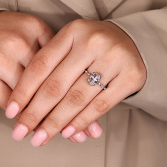 Hidden stone ring with oval rose cut diamond in white gold.
