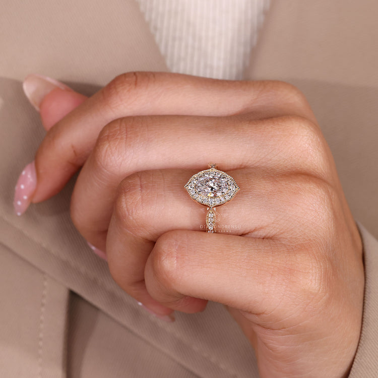 Oval Cut Ring With Round Halo And Pave Accent Diamonds.