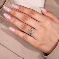 Oval Engagement Ring With Milgrain Edge And Halo Frame.