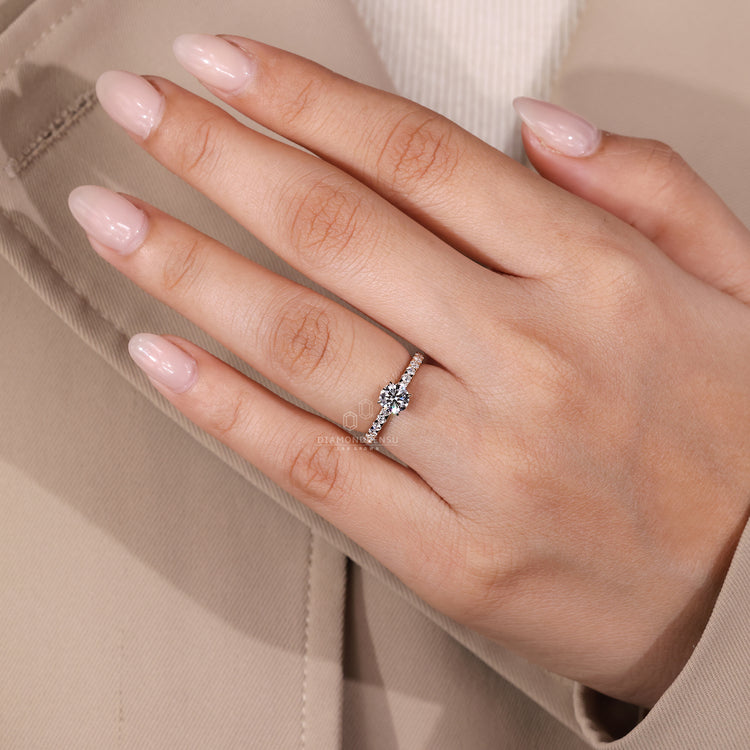 Diamondrensu engagement ring with round cut diamond and handmade finish.