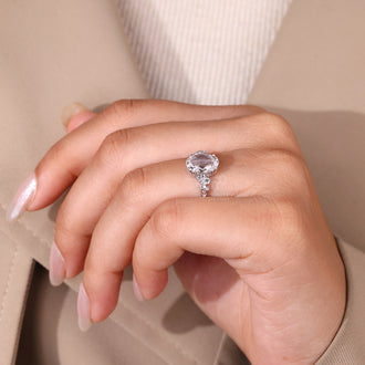 Double claw prong ring featuring oval rose cut diamond and handmade design.
