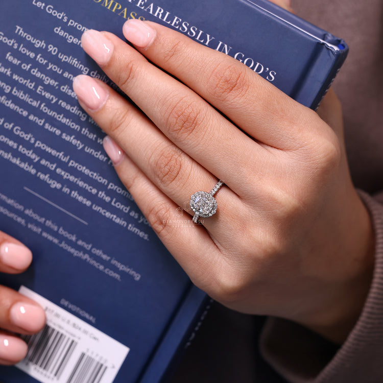 Milgrain setting ring featuring cathedral design and round cut pave band.

