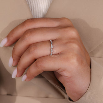 Lab grown diamond wedding band with a twisted full eternity design in white gold.
