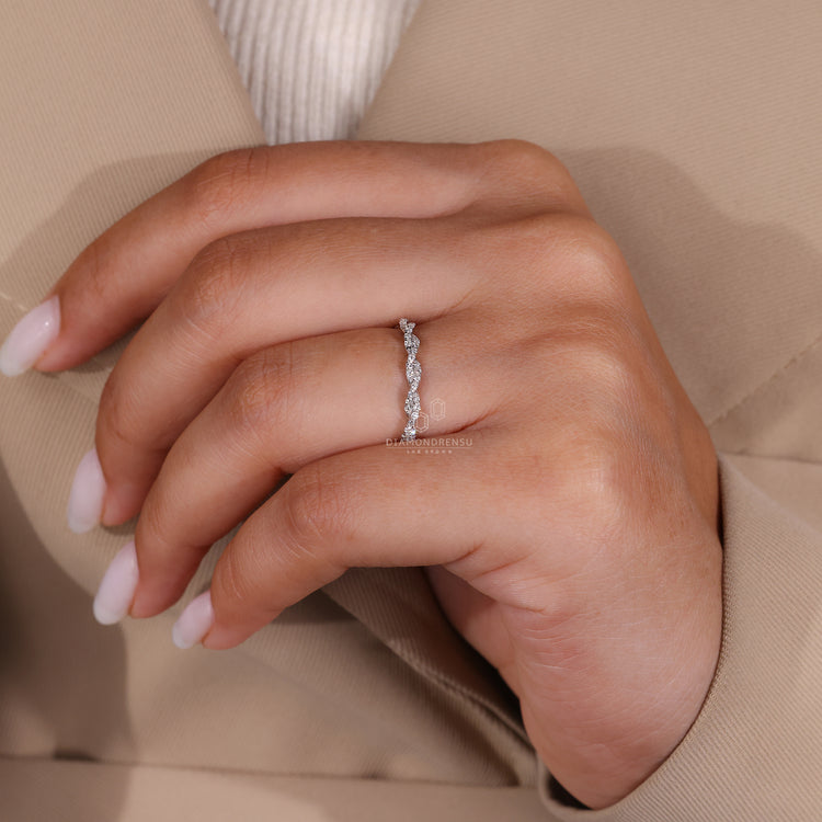 Lab grown diamond wedding band with a twisted full eternity design in white gold.
