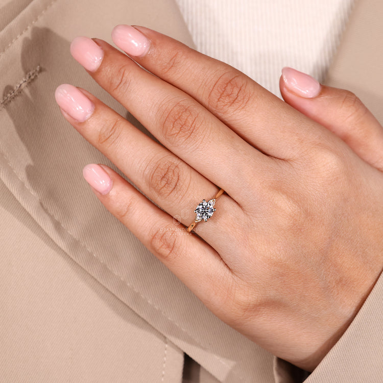 Diamondrensu engagement ring with yellow gold band and secure prong setting.
