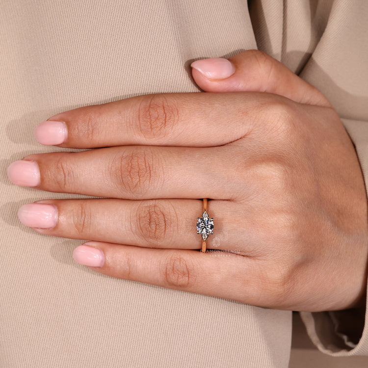 IGI certified three stone ring with cathedral setting and round side diamonds.
