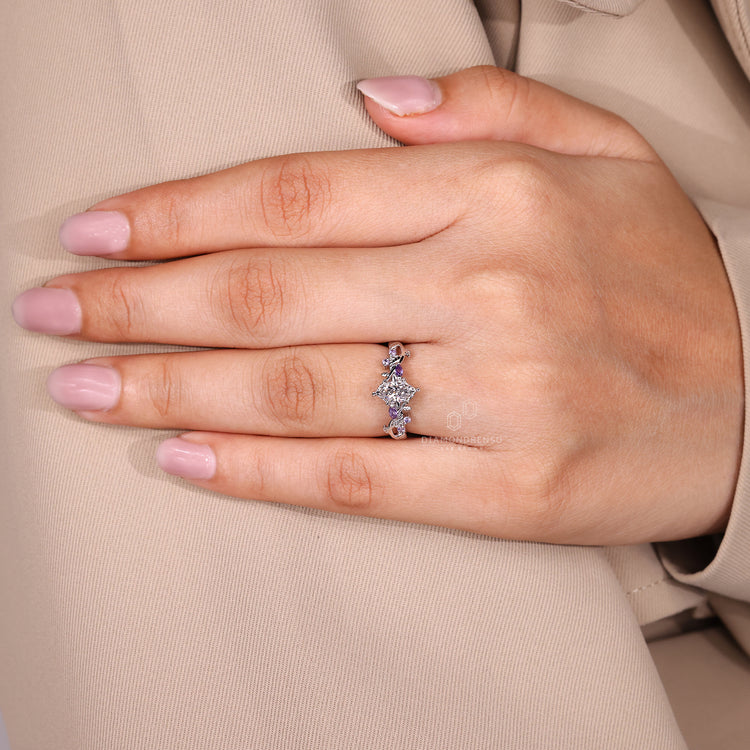 Tanzanite round side gemstone on twisted shank nature inspired ring.
