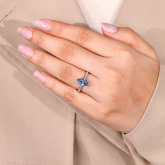 Round cut pave band ring paired with marquise cut blue diamond.
