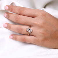 Hidden pavé engagement ring featuring oval cut lab grown diamond.
