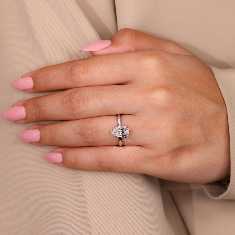 Pear old european cut diamond solitaire ring.
