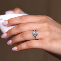 Round cut pave ring with tapered baguette side stones.
