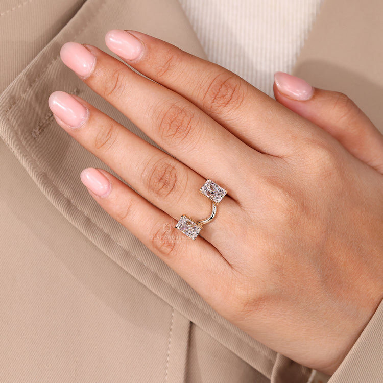 Diamondrensu engagement ring featuring radiant cut diamonds in claw prongs.
