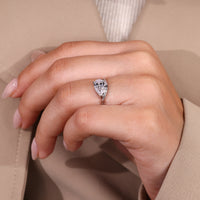 Handmade pear solitaire ring featuring 2 round prongs and V shaped design.
