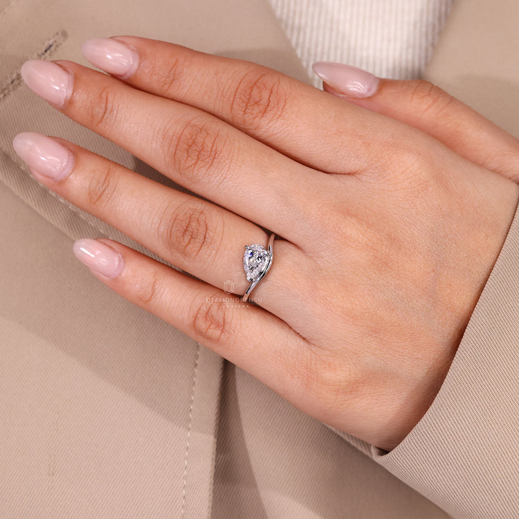 IGI certified pear solitaire engagement ring handcrafted in white gold.
