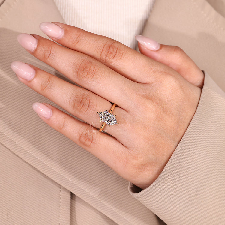 Yellow gold cathedral ring with bridge accent and hidden halo.
