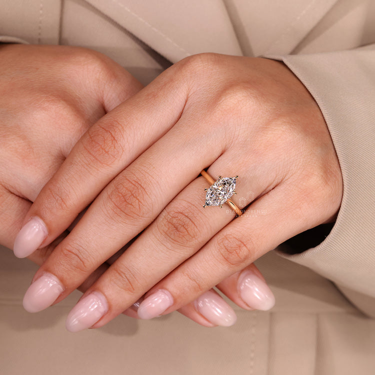 Custom yellow gold ring with lab grown diamond and hidden halo.
