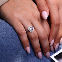 Round diamond side stone ring with lab grown center diamond.
