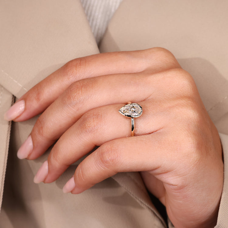 Handmade pear cut engagement ring with 8 claw prong setting.
