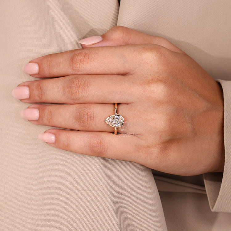 Diamondrensu handmade pear cut diamond engagement ring bezel set.
