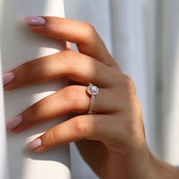 Elegant lab diamond halo ring with four-prong round setting.
