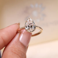 IGI certified pear cut diamond engagement ring with 8 claw prong.
