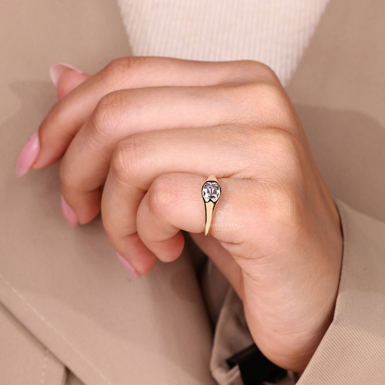 Flush setting old mine cushion diamond ring with tapered shank.
