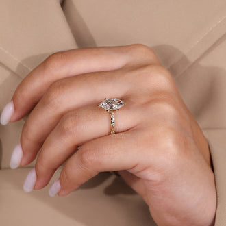 Custom engagement ring with a Dutch marquise diamond, tailored to suit her personal style.
