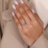 Halo setting adds sparkle to the white gold engagement ring.
