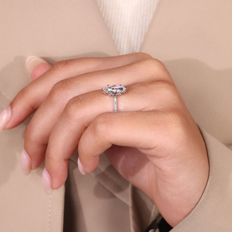 Round cut pave ring in a custom handmade white gold design.
