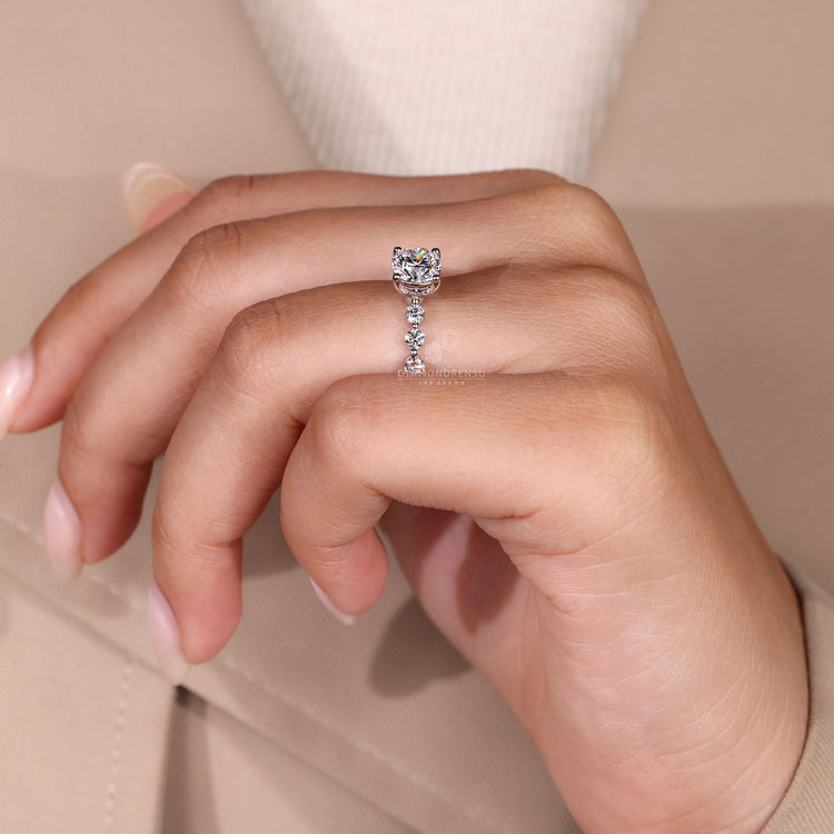 Handmade jewelry ring showcasing round cut diamonds in 4 prong setting.
