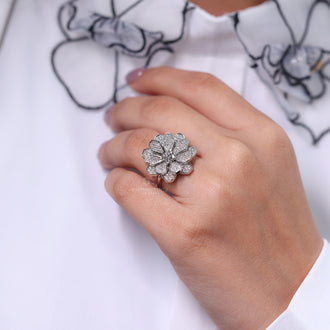 Round diamond ring with nature inspired design and vintage accents.
