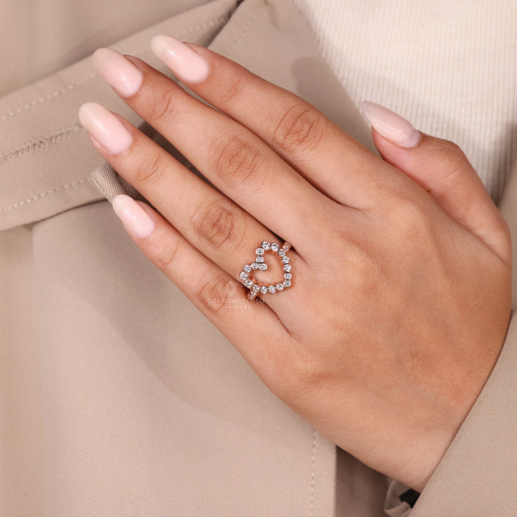 Handmade jewelry featuring heart shaped diamond with rose gold band.
