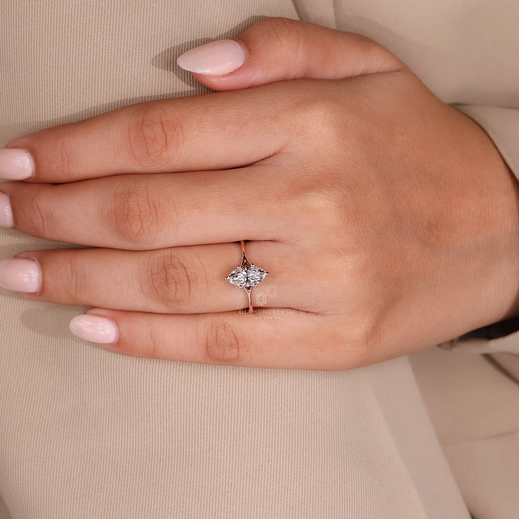 Handmade jewelry with marquise solitaire design.
