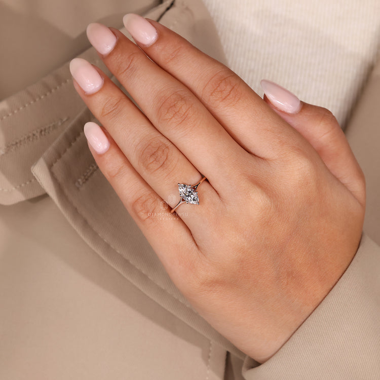 Rose gold engagement ring with solitaire diamond.
